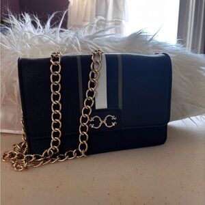 C. Wonder Black and Gold Crossbody Bag